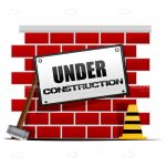 Under Construction Sign on Abstract Brick Wall